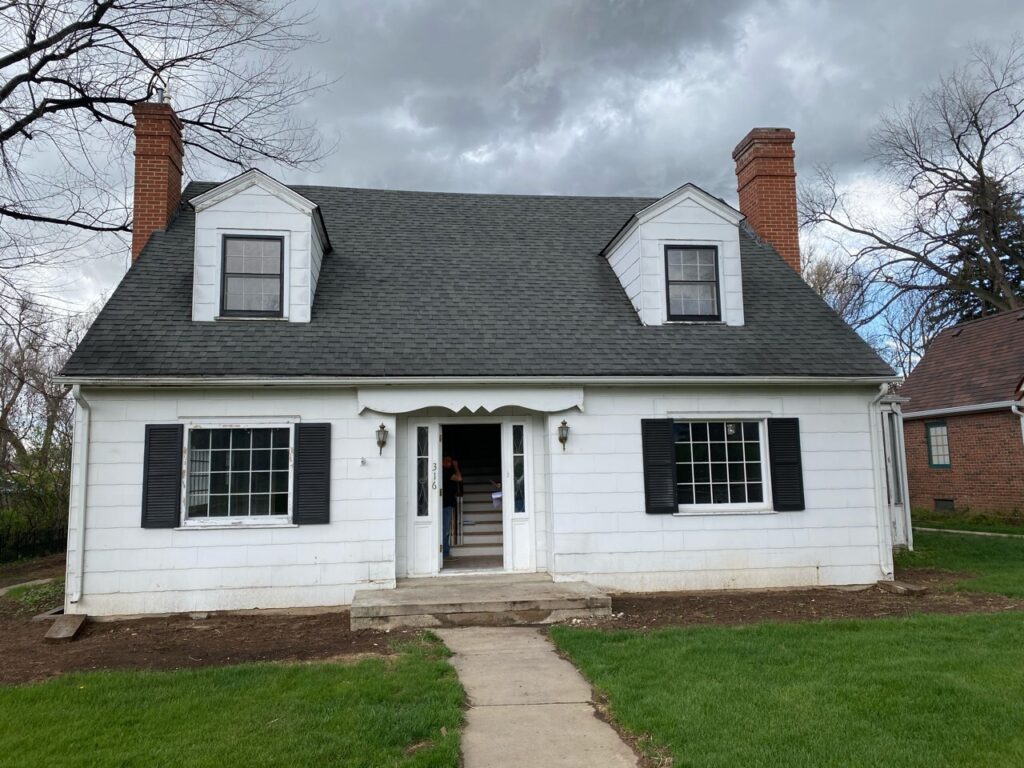 Before-and-after photo showcasing a remarkable home transformation from dated and white to modern elegance. The 'before' image depicts a lackluster exterior with faded paint, a plain porch, and minimal curb appeal. Inside, the interior is outdated with white walls and traditional fixtures. The 'after' image reveals a stunning modern renovation. The exterior boasts a refreshed facade with contemporary siding, a stylishly redesigned porch, and enhanced landscaping. Inside, the interior has undergone a complete remodel, featuring modern finishes, an open-concept layout, and updated fixtures. The transformation exudes sophistication and showcases the seamless integration of modern design elements throughout the home.