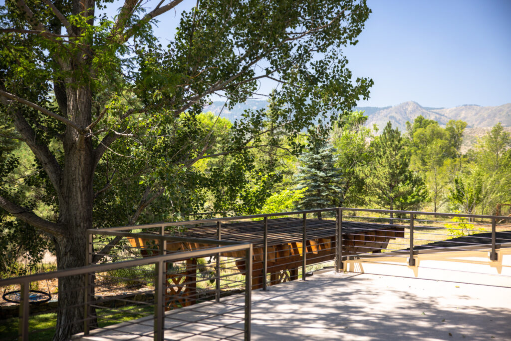 An upper deck addition in Fort Collins Colorado overlooking the front range mountains. This remodel and addition gives the homeowners a peaceful and scenic view from which to sip their coffee and enjoy a quiet moment before going downstairs in the morning.